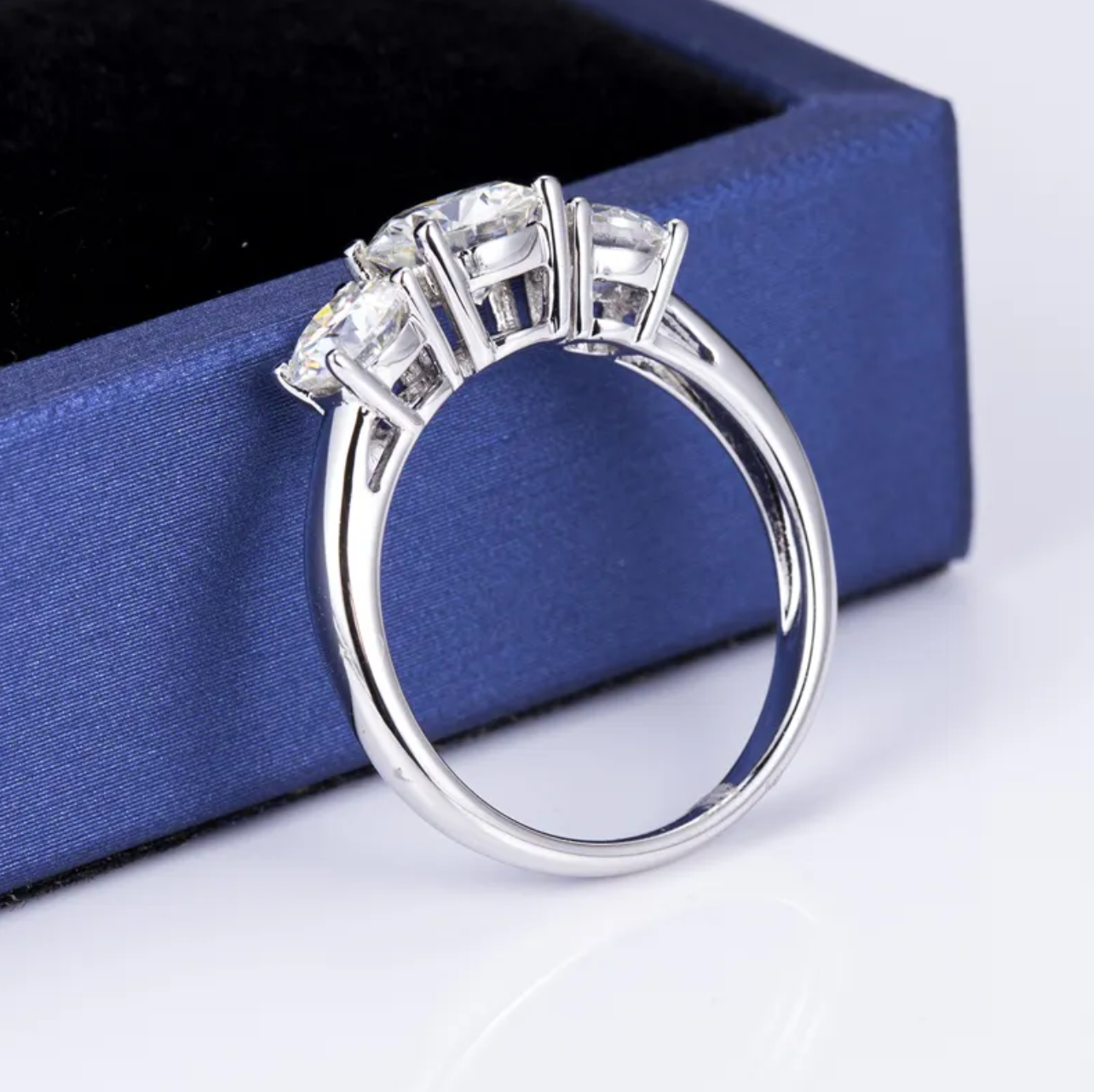 Round Three Stone Engagement Ring
