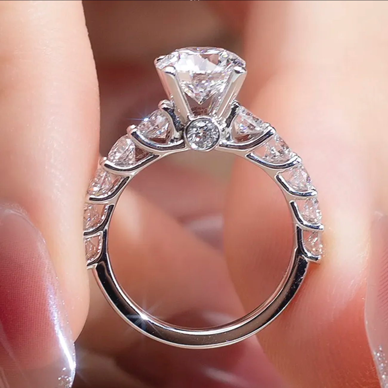 Round Solitaire With Side Stones Engagement Ring