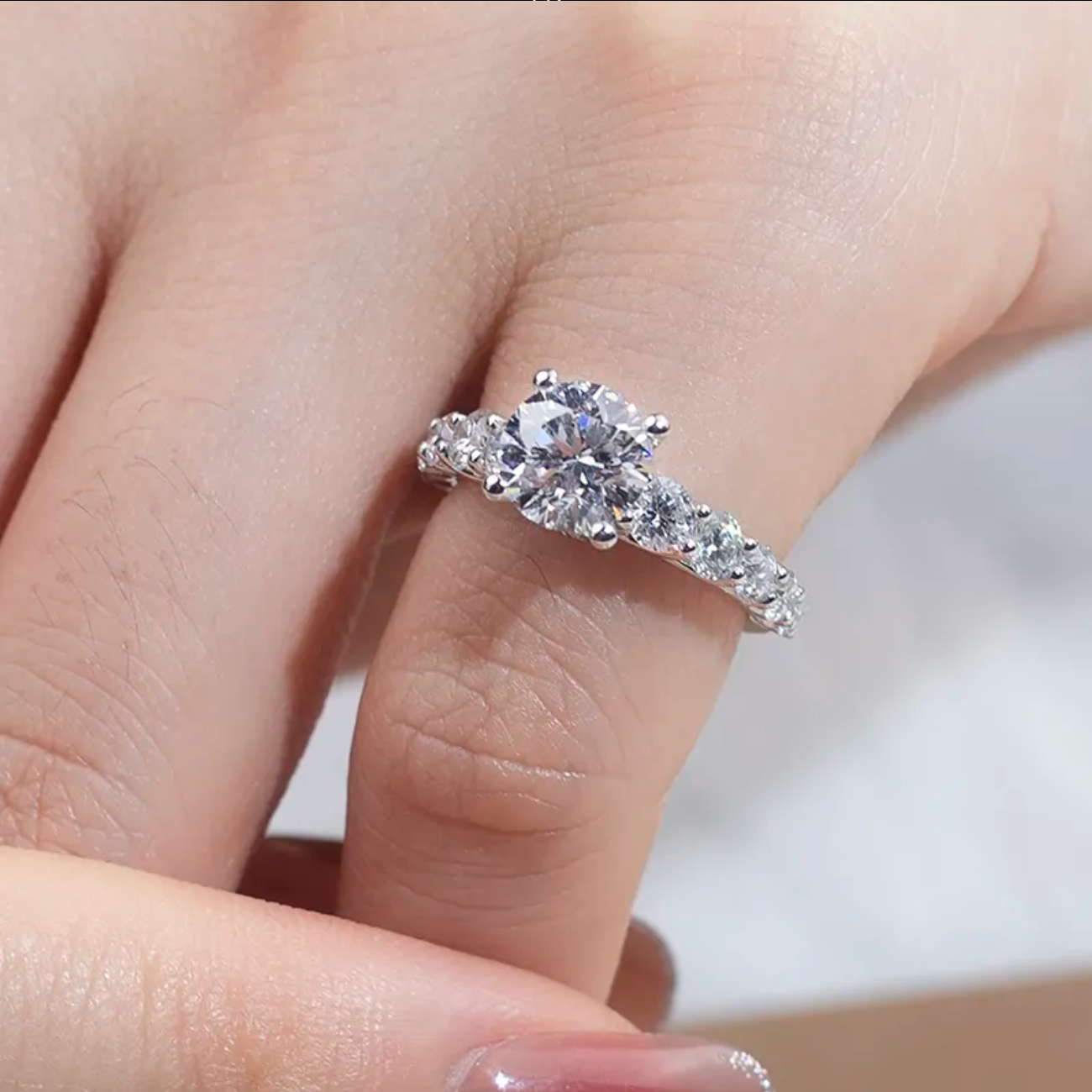 Round Solitaire With Side Stones Engagement Ring