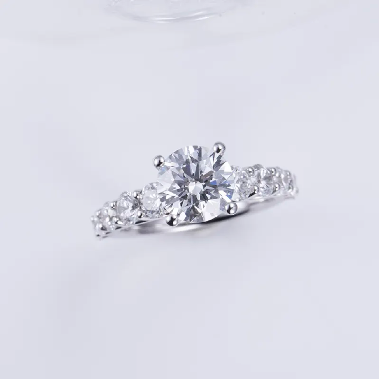 Round Solitaire With Side Stones Engagement Ring